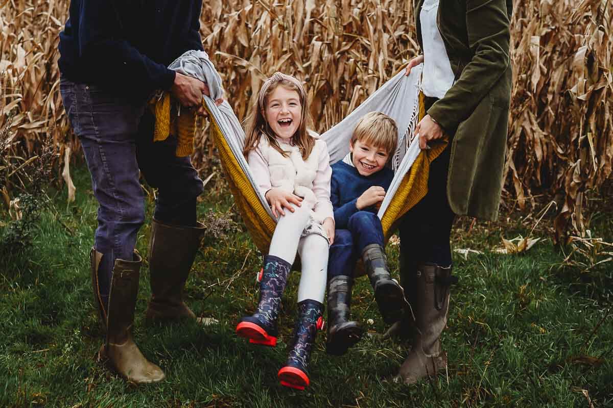 a brother and sister having fun during a family photoshoot in Marlborough