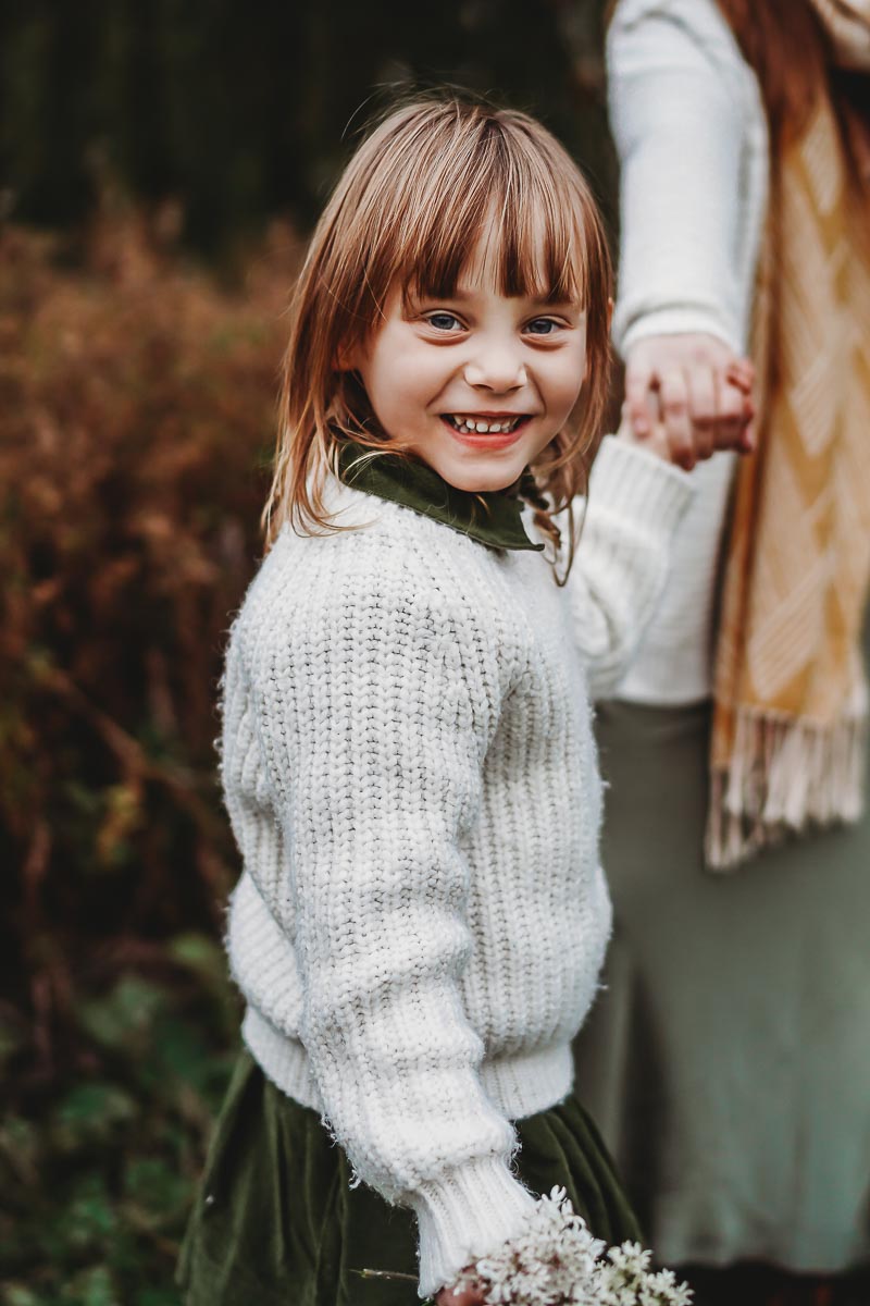 little girl smiling at the camera for a oxford family photoshoot