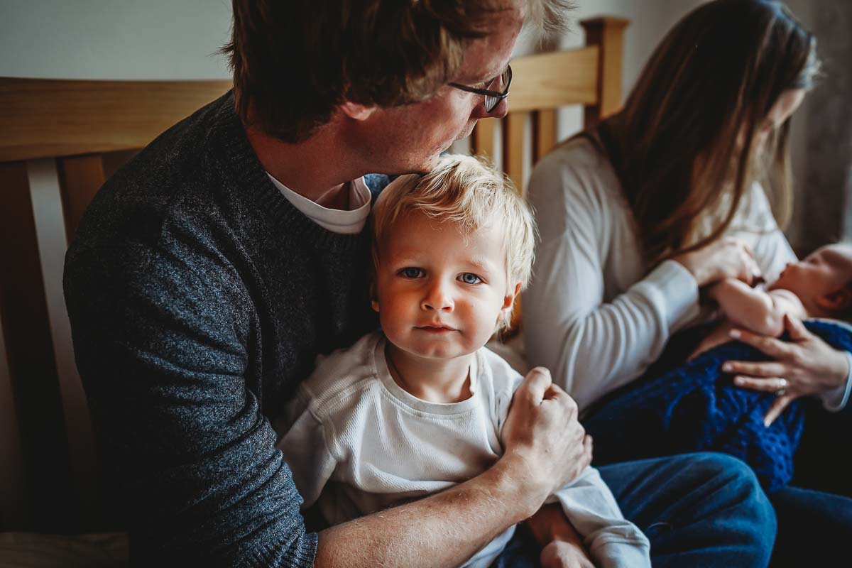 little boy looking at the camera during a newborn  photoshoot Newbury