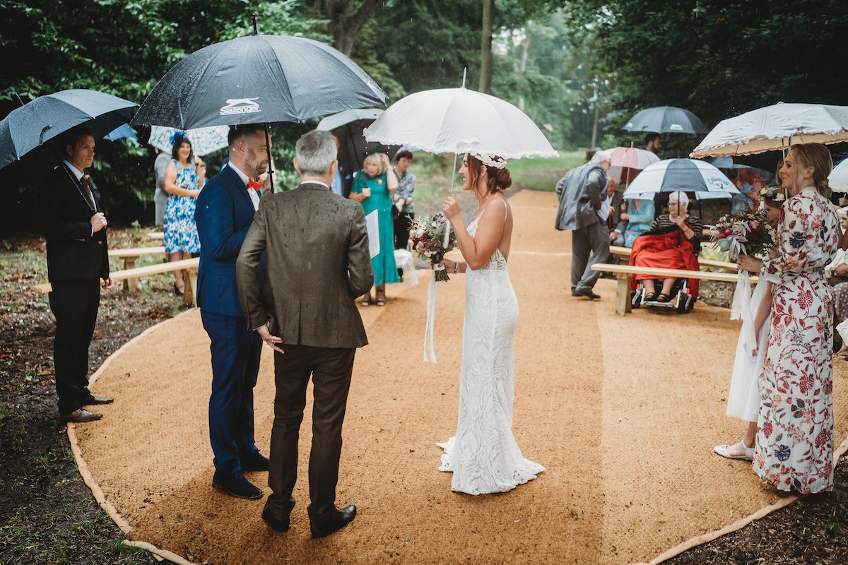 a bride & groom during their woodland wedding taken by a oxford wedding photographer