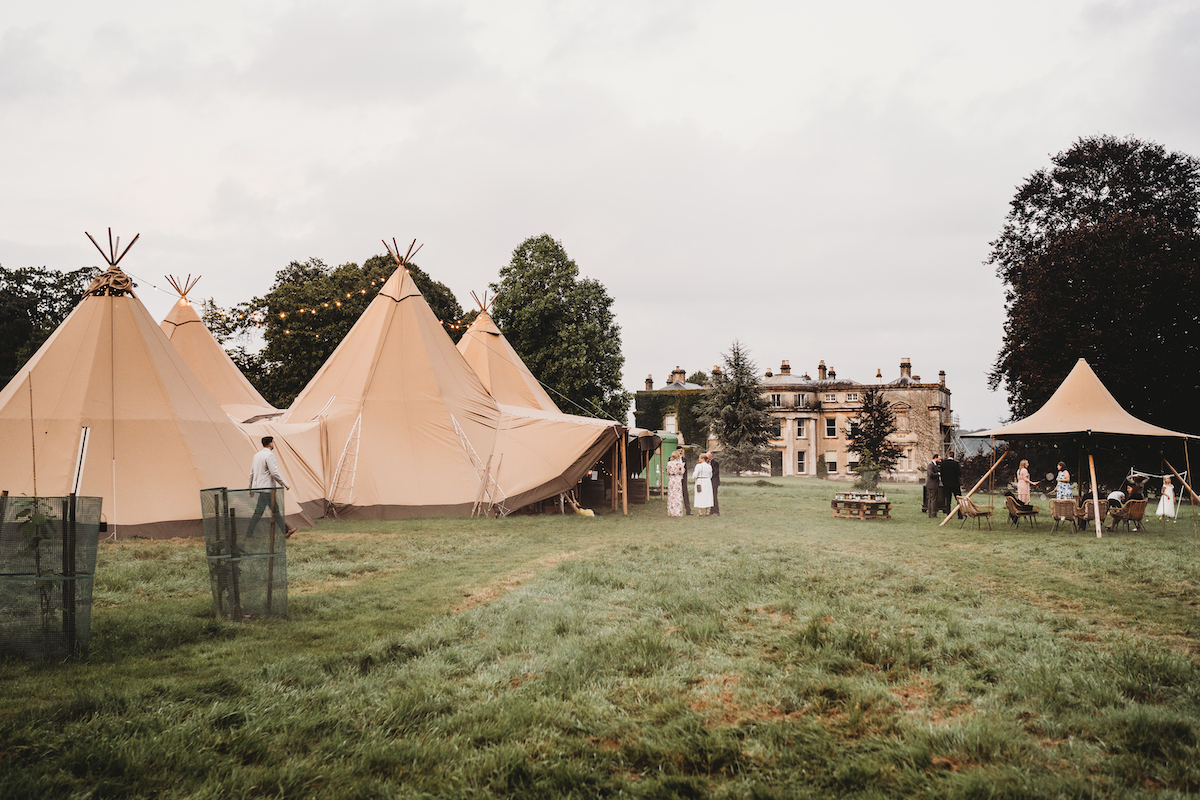 wedding tipis set in front of a stately home