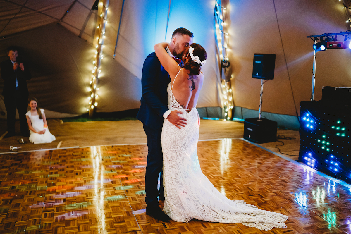 a bride & grooms first dance at their wedding