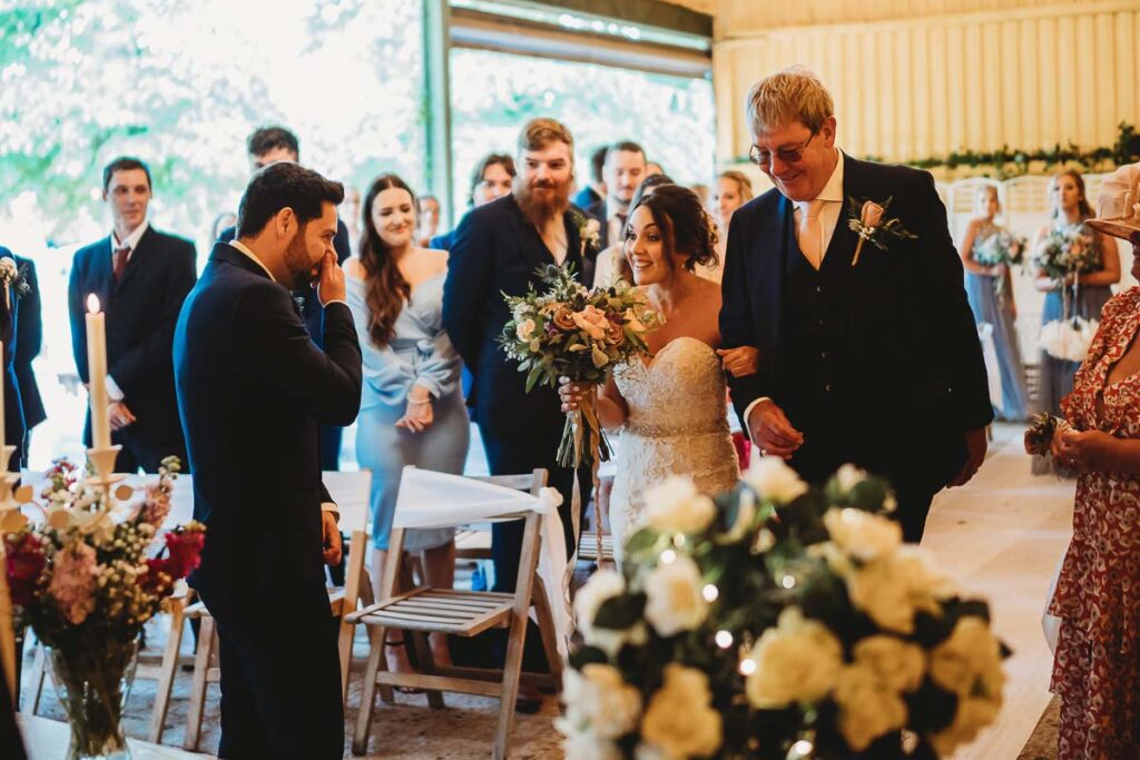 Bride walking down the aisle at Herons Farm Reading 