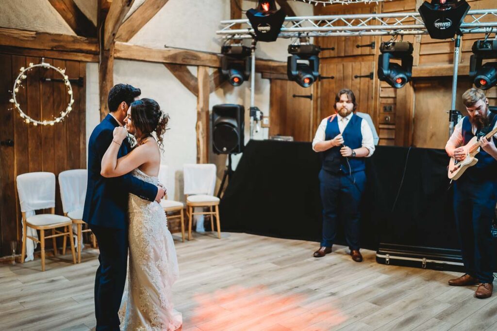 2 best men singing the first dance song at Herons Farm Barn 