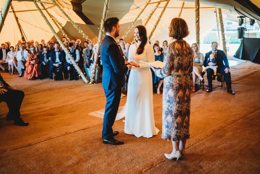 Newbury wedding photography of a ceremony in the tipis