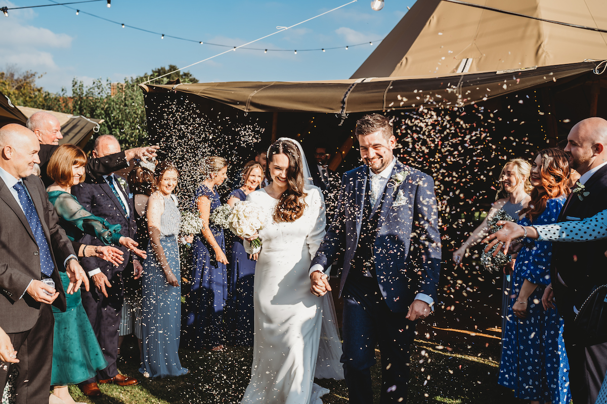 confetti being thrown at newly weds  in Newbury