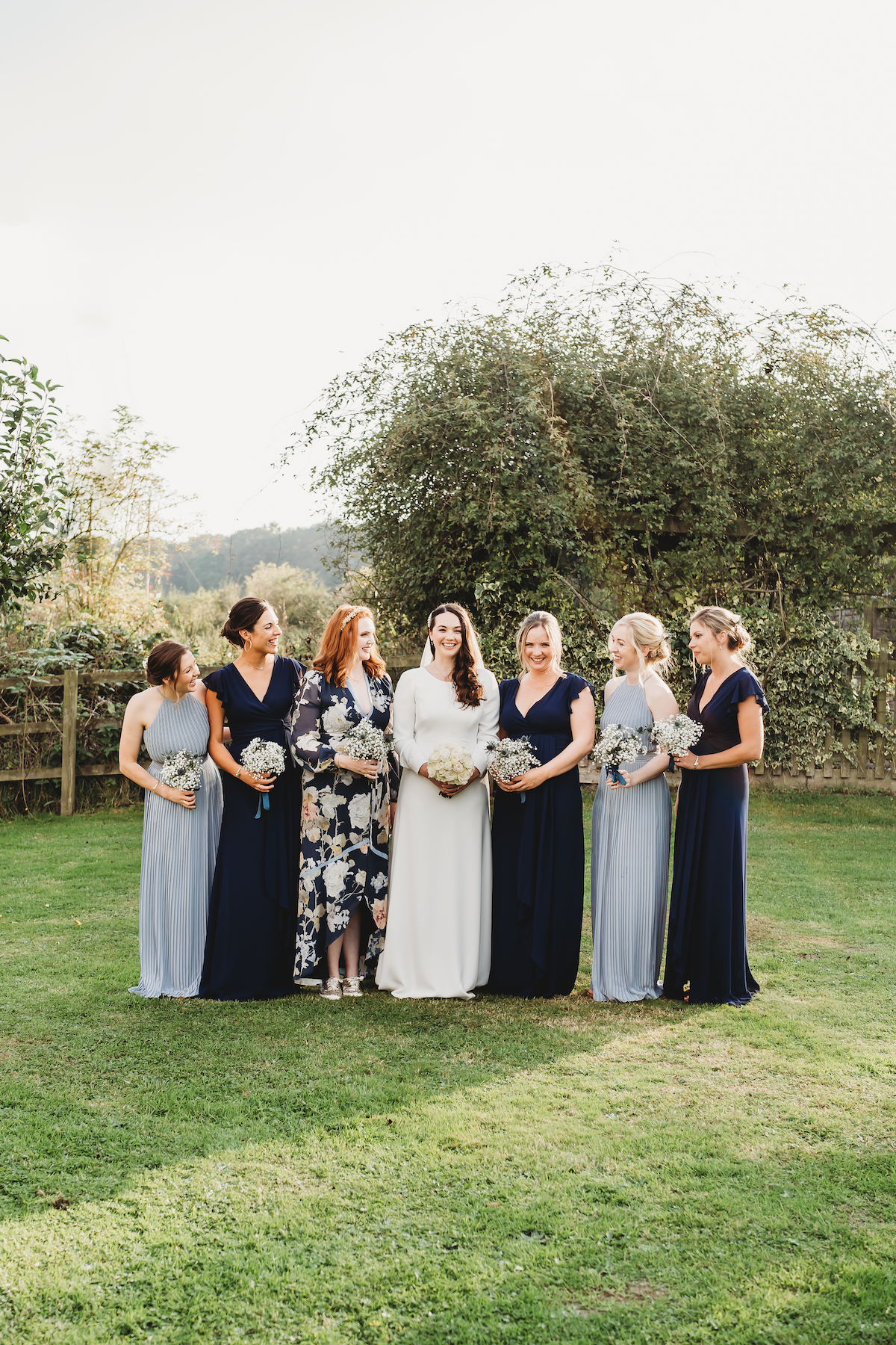 bride and bridemaids posing for group shoots during a wedding in Newbury 