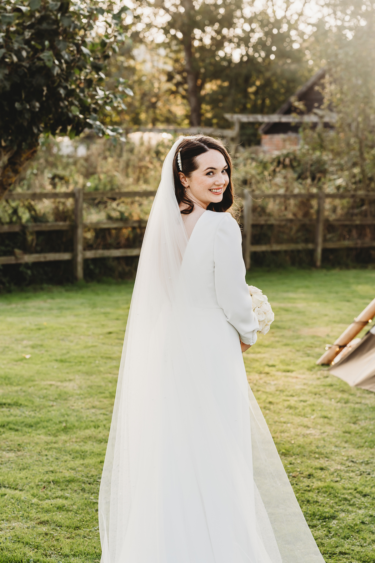 bride smiling and looking over her shoulder for a Berkshire Wedding Photographer