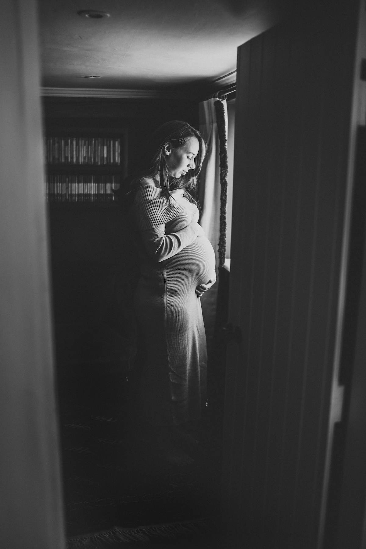 a pregnant lady looking at her bump for a berkshire pregnancy photography