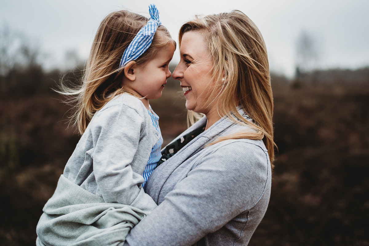 mother and daughter cuddling nose to nose for a berkshire family photographer