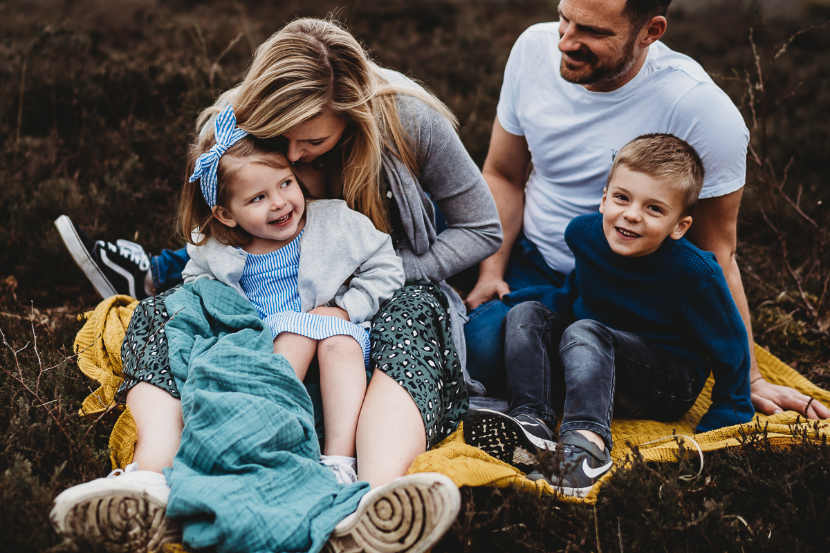 family sat down cuddling for a thatcham family photoshoot