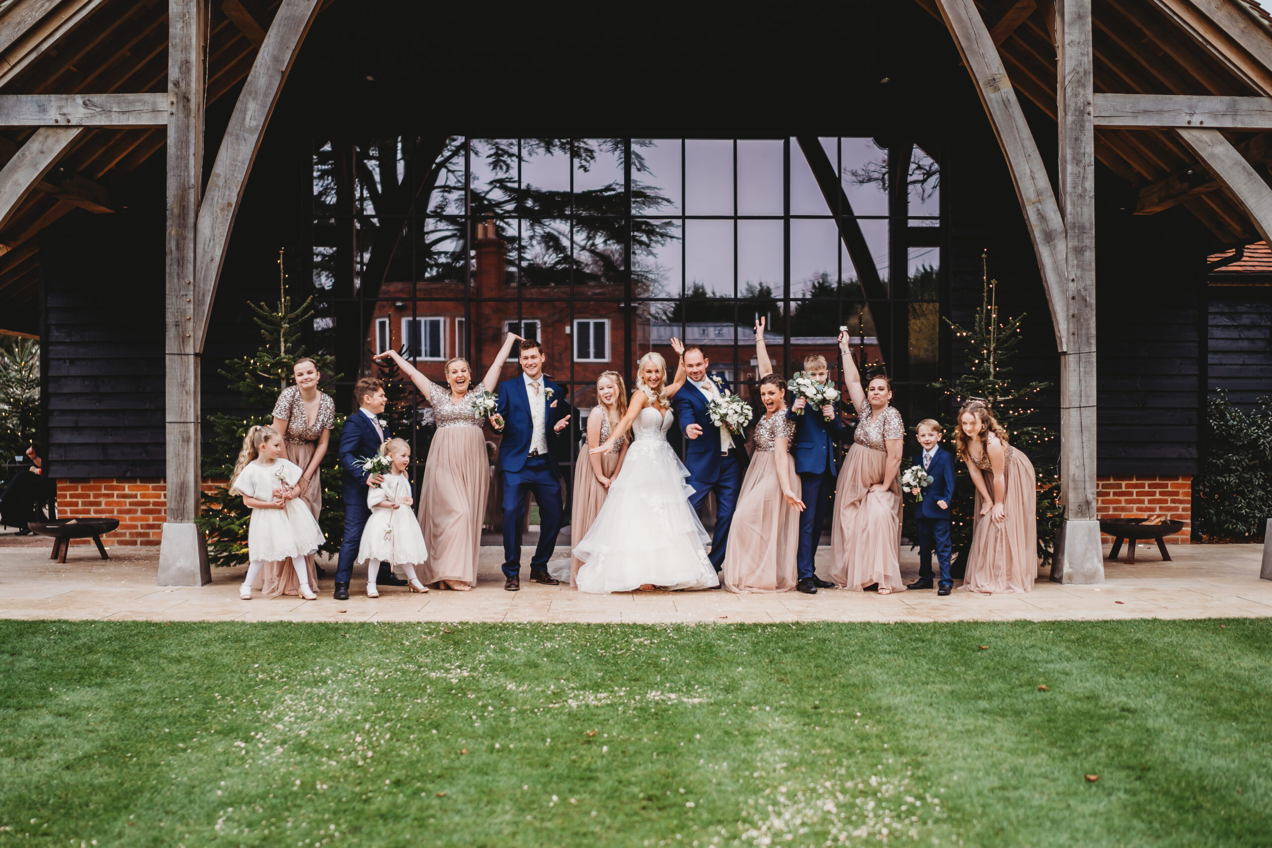 a wedding party striking a pose for a Berkshire wedding photographer