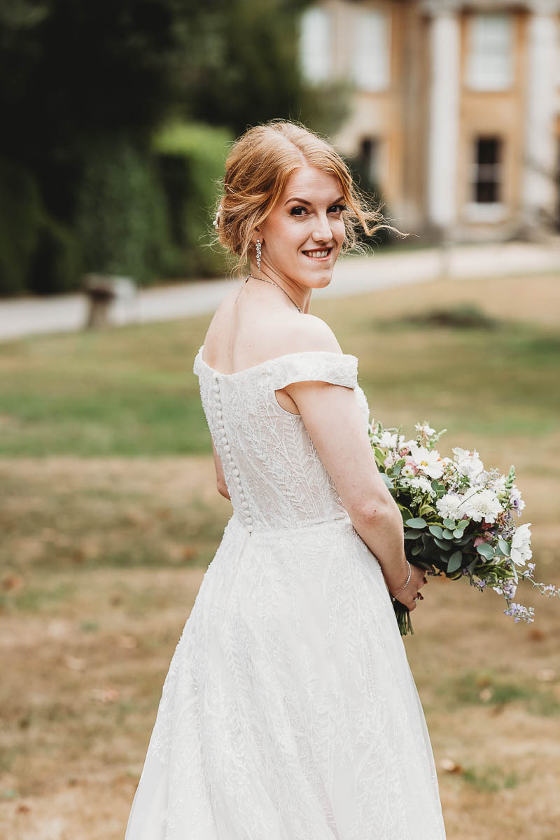 Boho styling inspiration showing a bride looking over her shoulder ahead of her tipi wedding