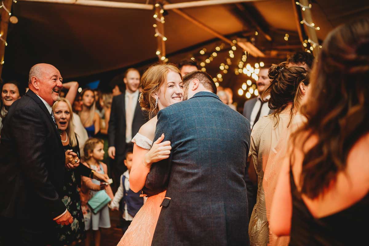 a bride and groom cuddling and dancing for a berkshire wedding photographer