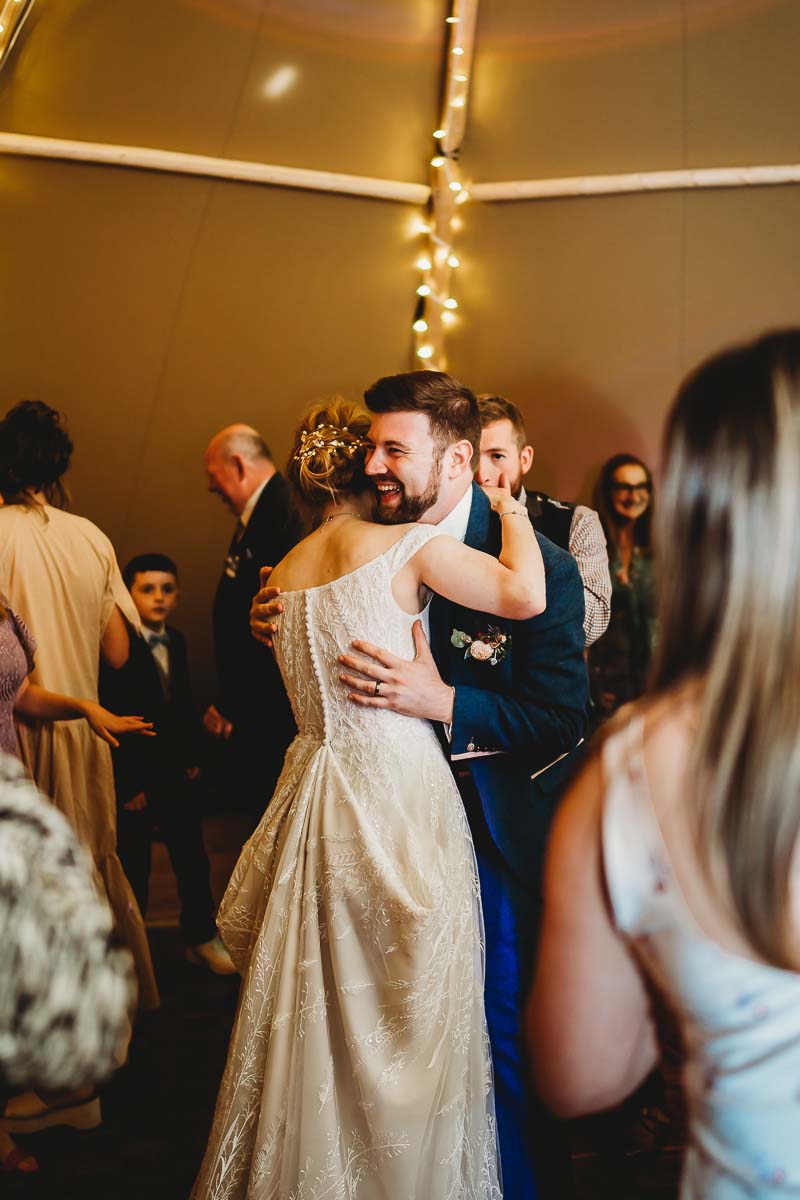 a bride and groom dancing on the dance floor at a woolley park estate wedding