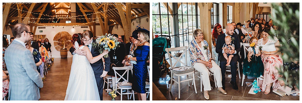 The bride hugging her brother before she gets married at a countryside barn in newbury
