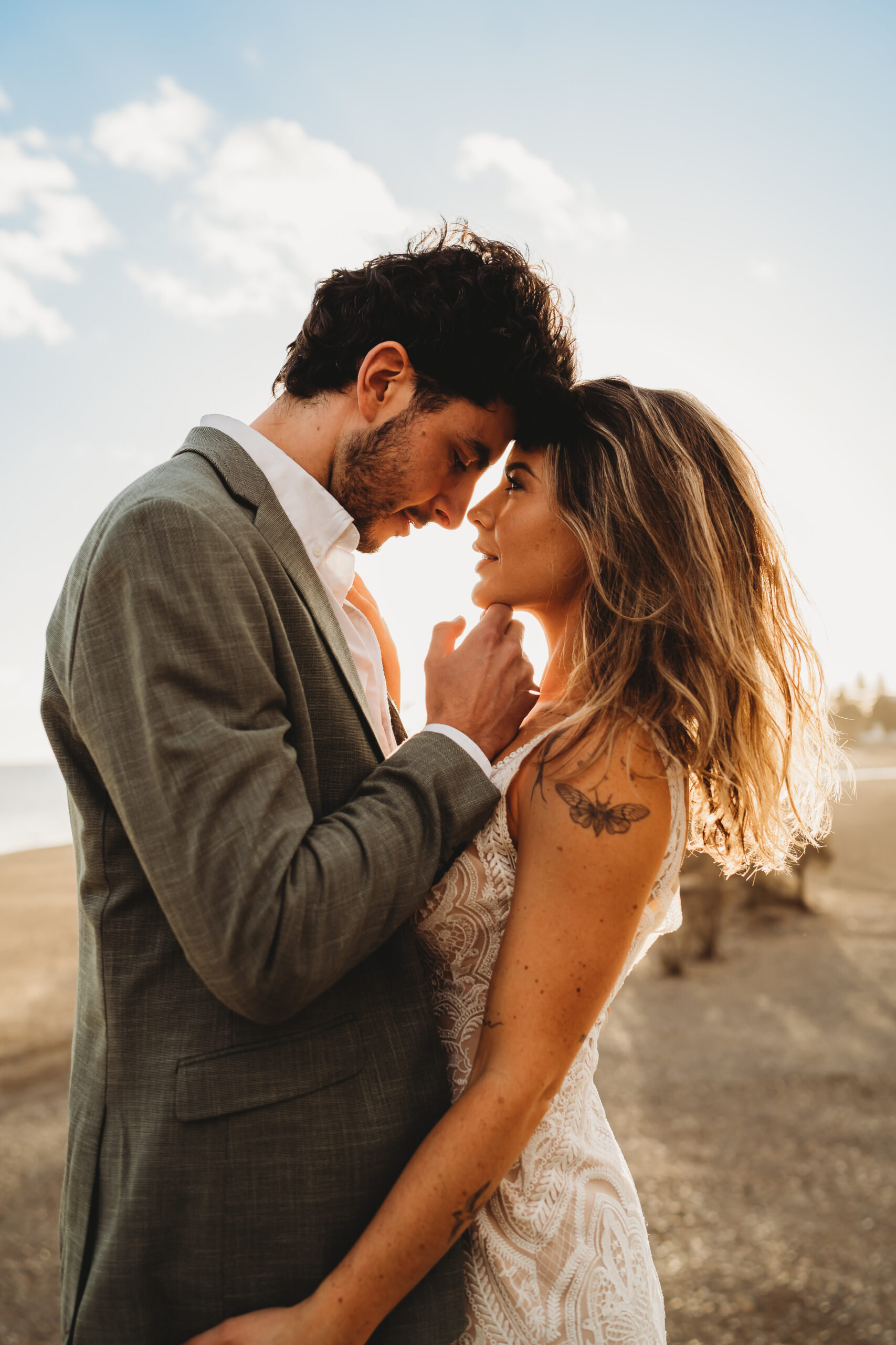 a groom looking into his new brides eyes, as they almost kiss for a gran canaria wedding photographer