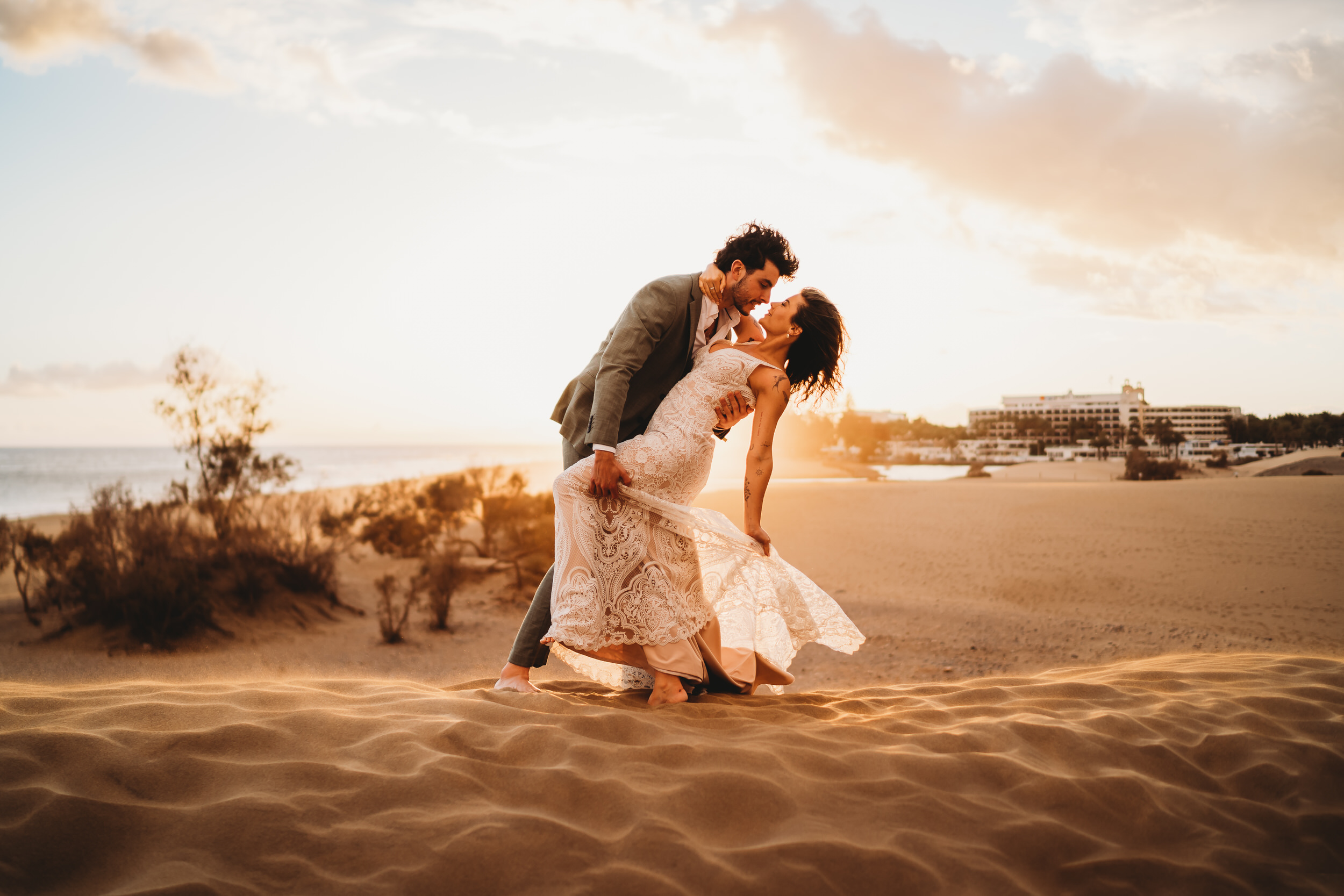 a groom dipping his new bride for a kiss, taken by a destination wedding photographer