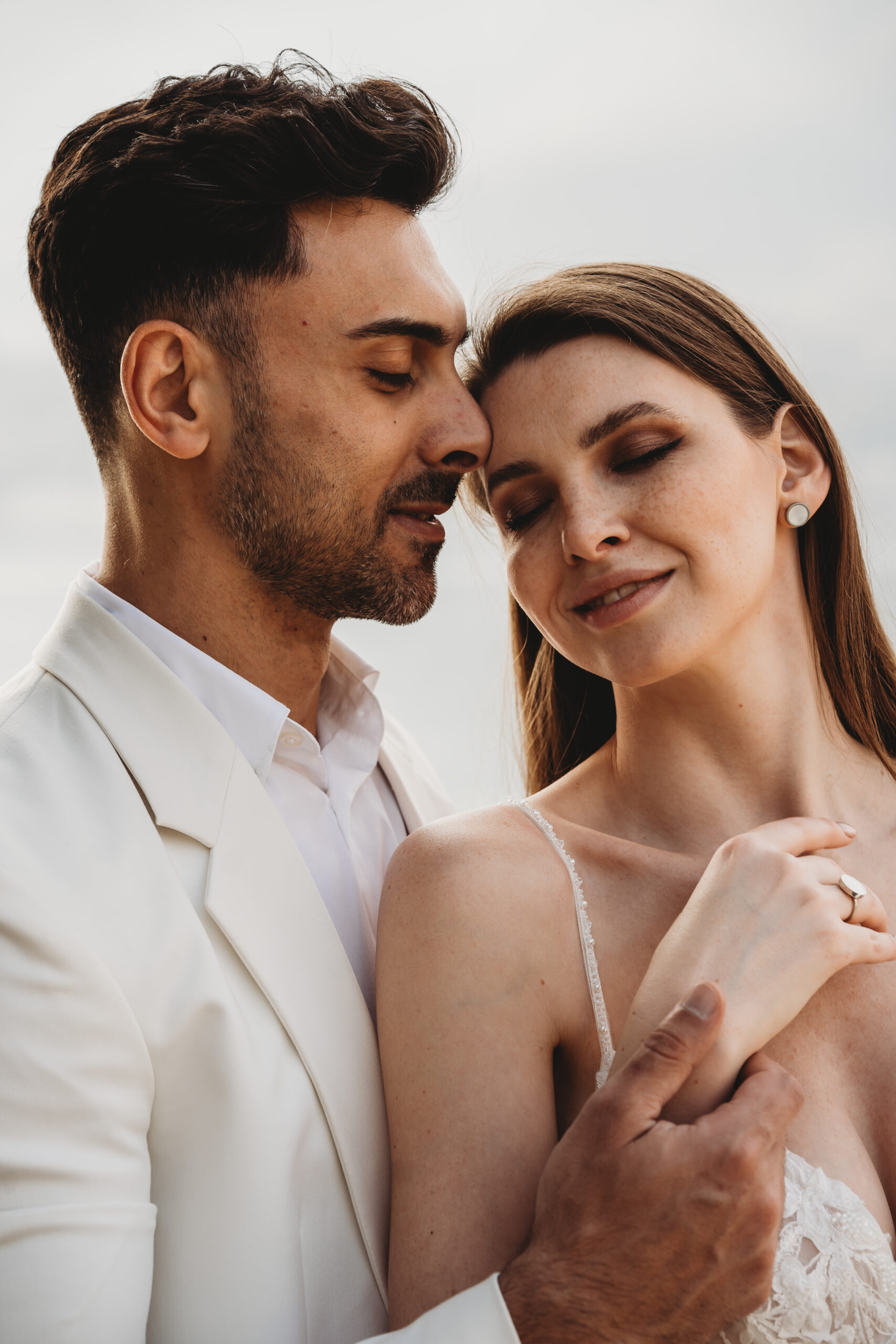 A bride and groom leaning into each other after their intimate elopement at lake Como