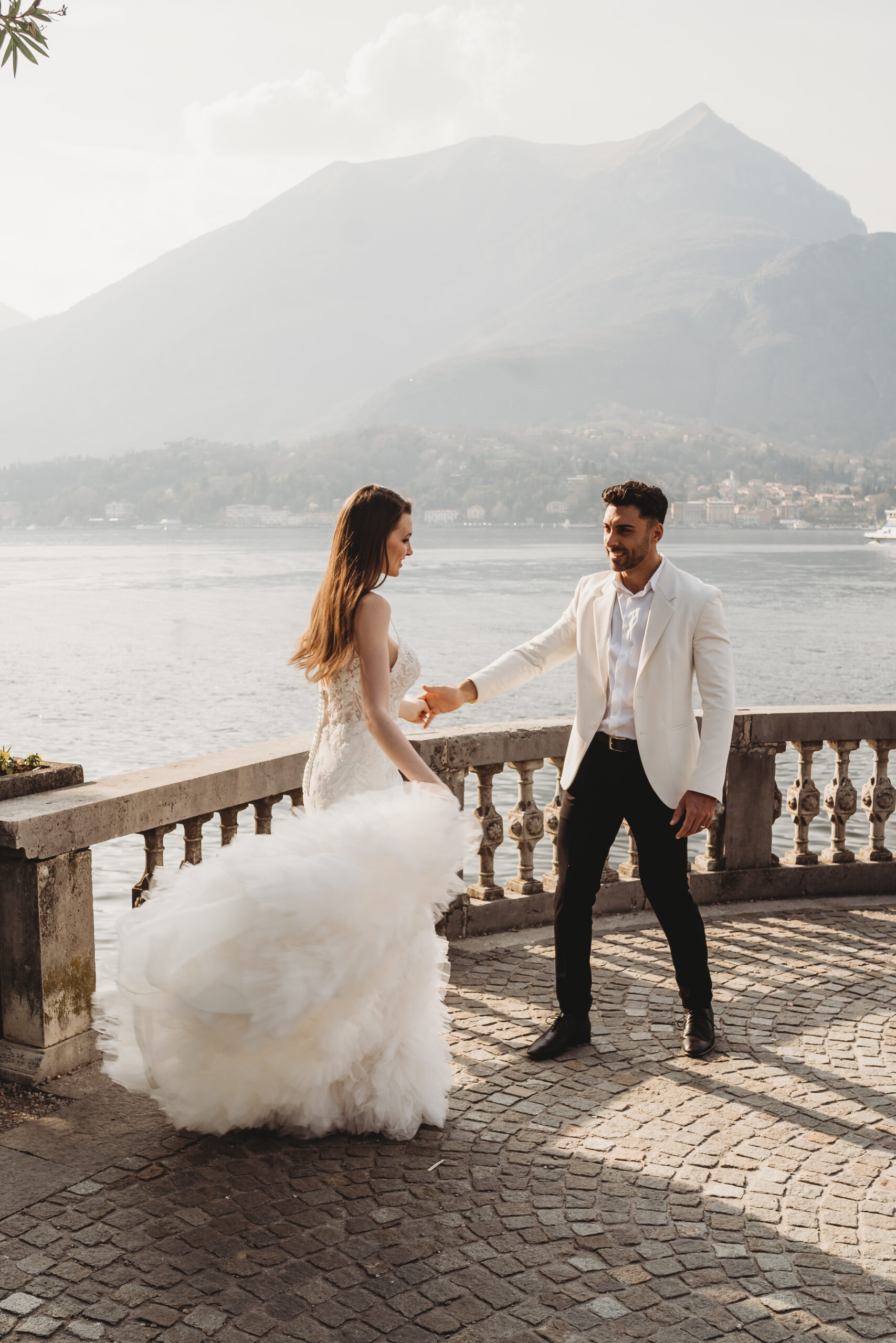 a couple dancing in front of Lake Como for their elopement in italy