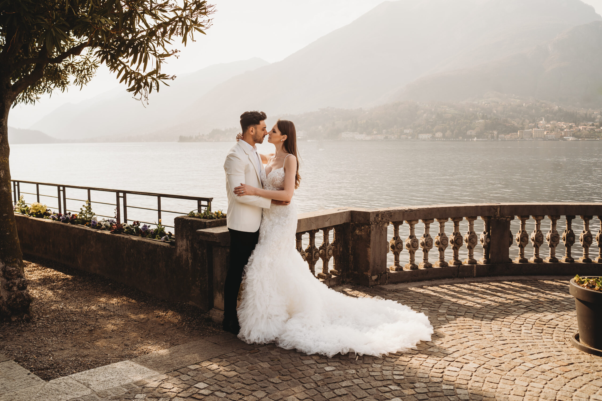 a bride and groom cuddling following their lake como elopement 