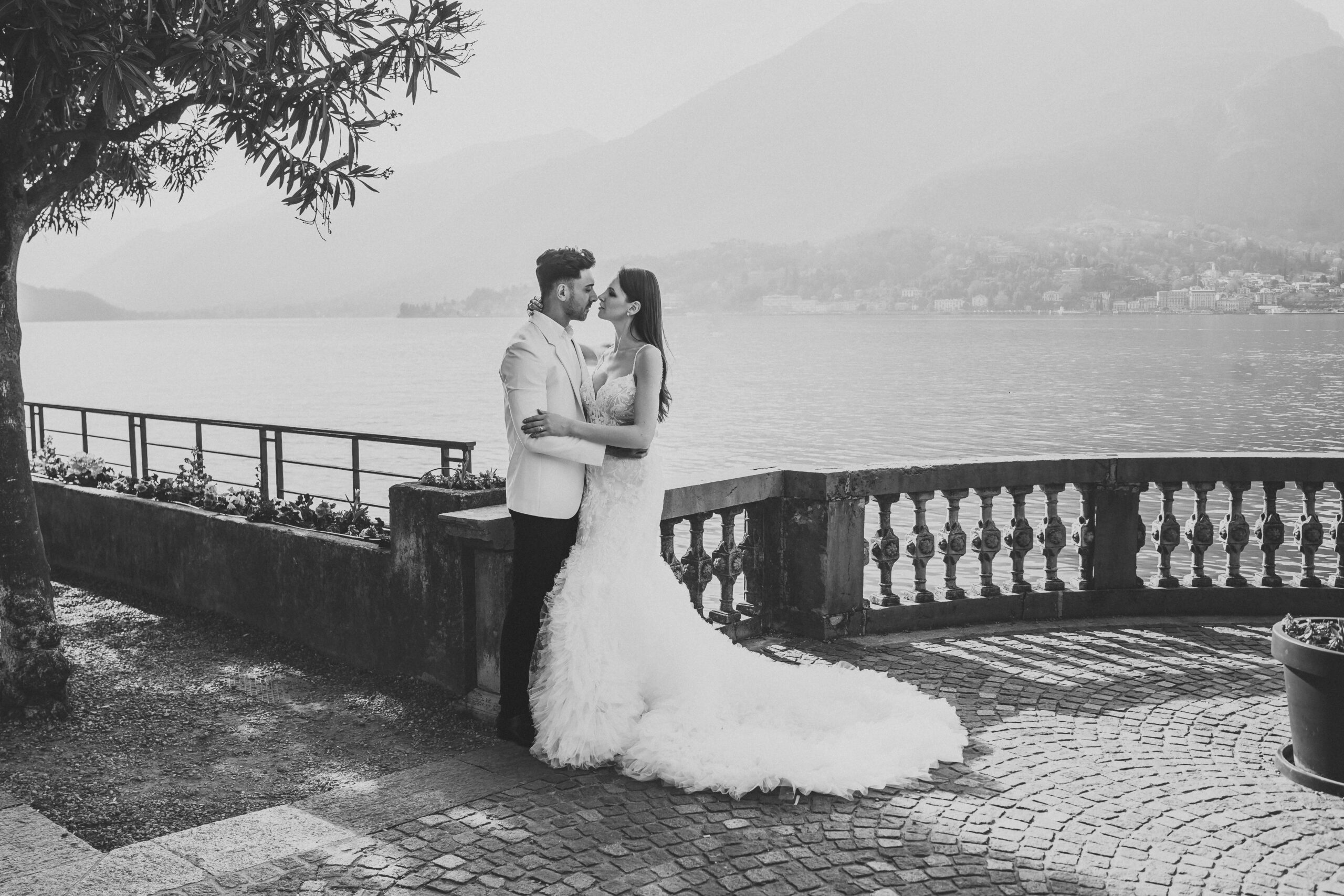 a bride and groom chatting and cuddling after their lake como wedding