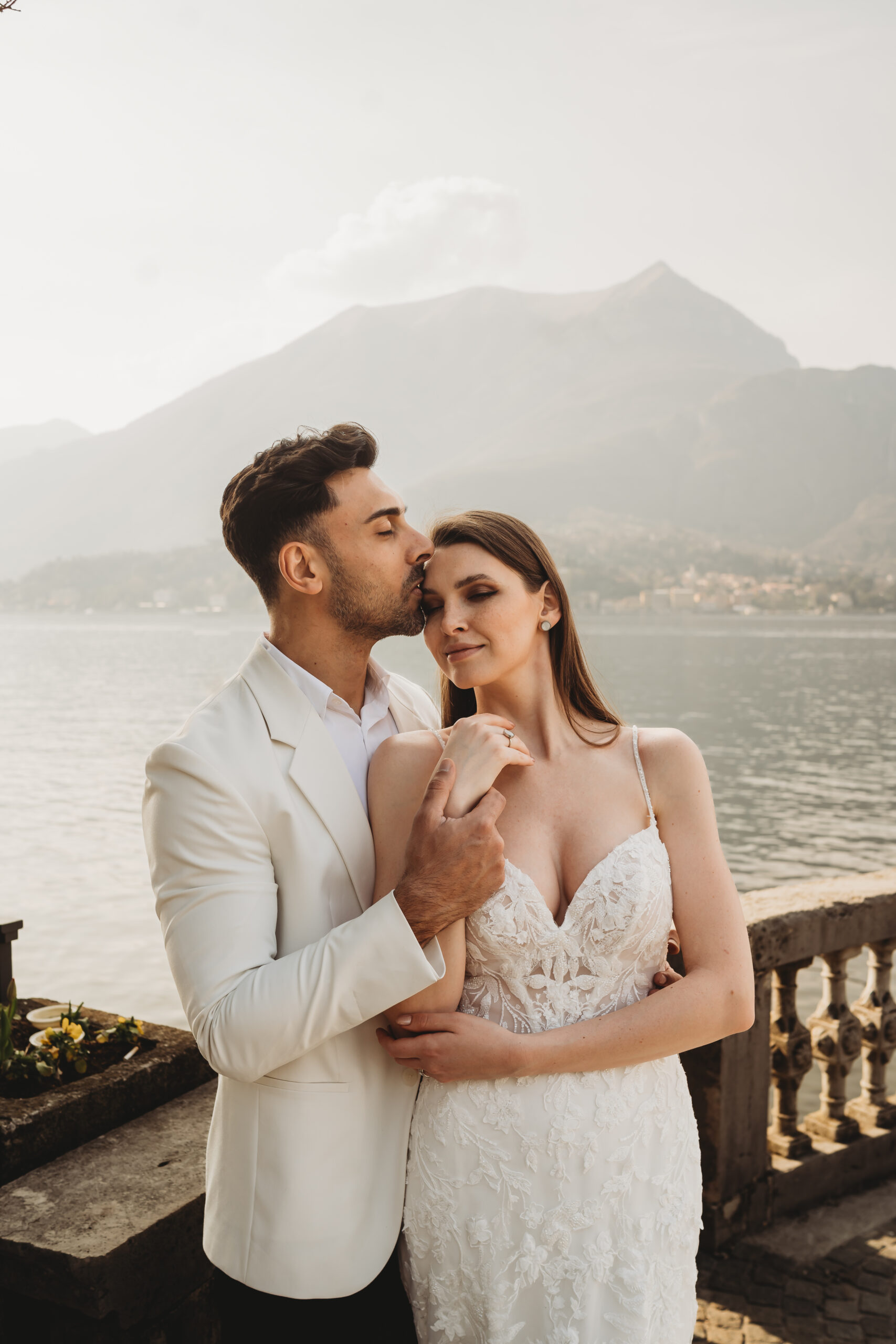 a bride and groom cuddling after their italian wedding
