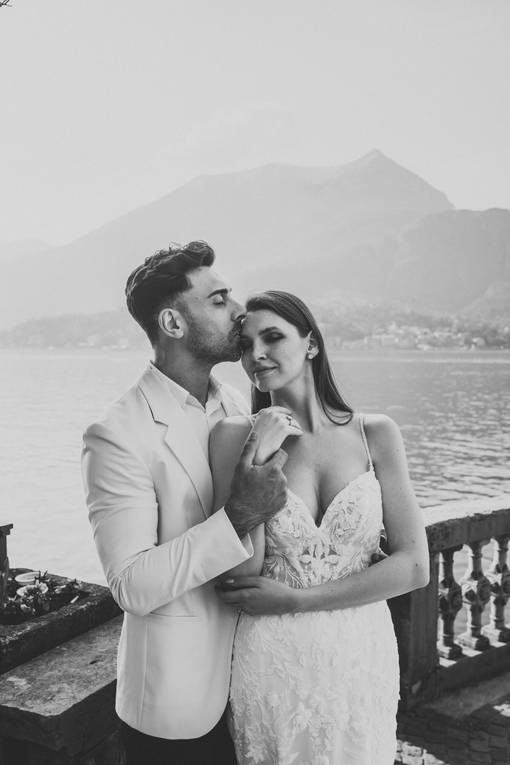 a newly wed couple cuddling in after their lake como elopement