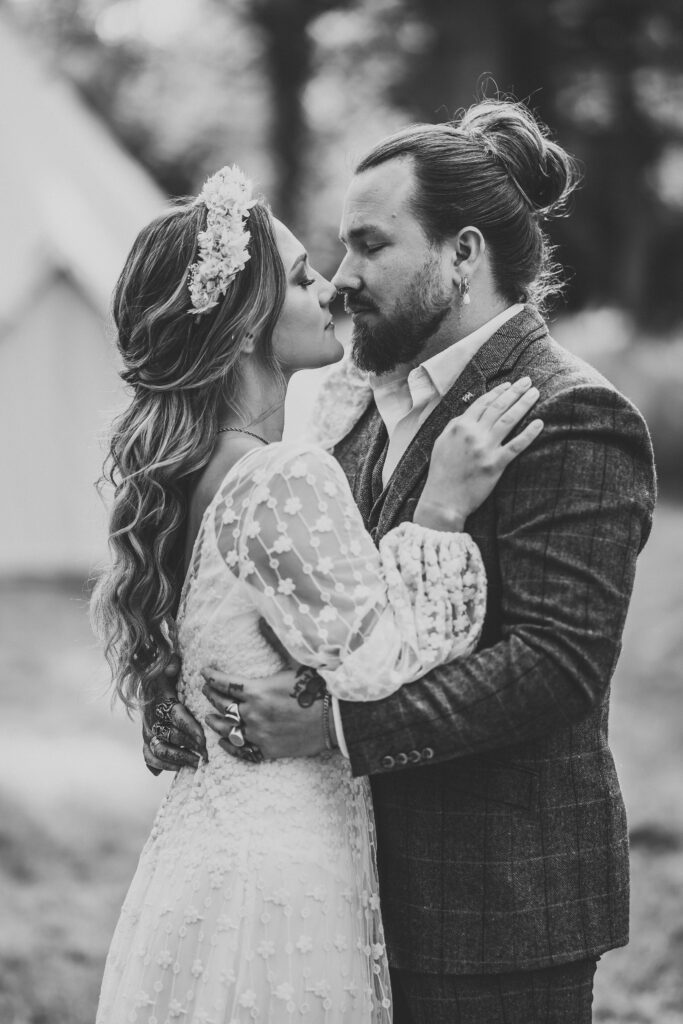 Woolley Park photography of a black and white photo of a newky wed couple kissing 