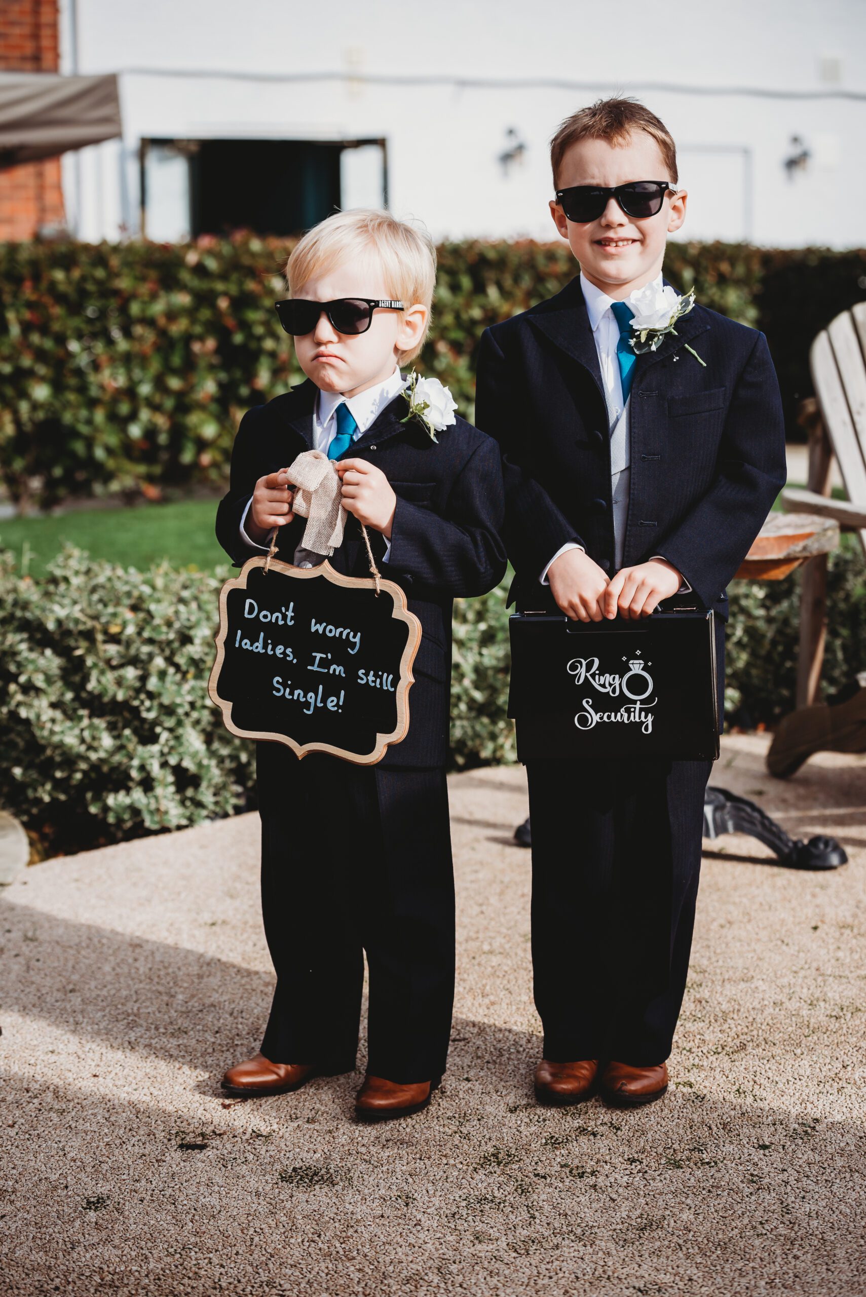 two page boys ready for a wedding to start with shades on for a hampshire wedding photographer 