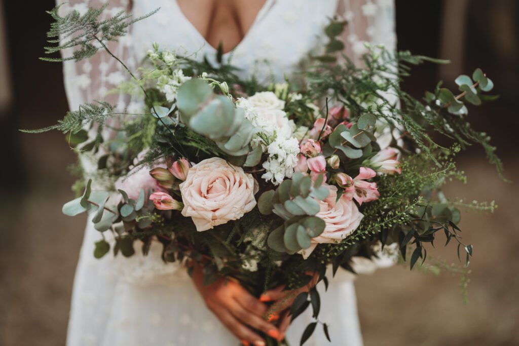 Festival wedding photography of a full wedding bouquet full of pink flowers and eucalyptus 