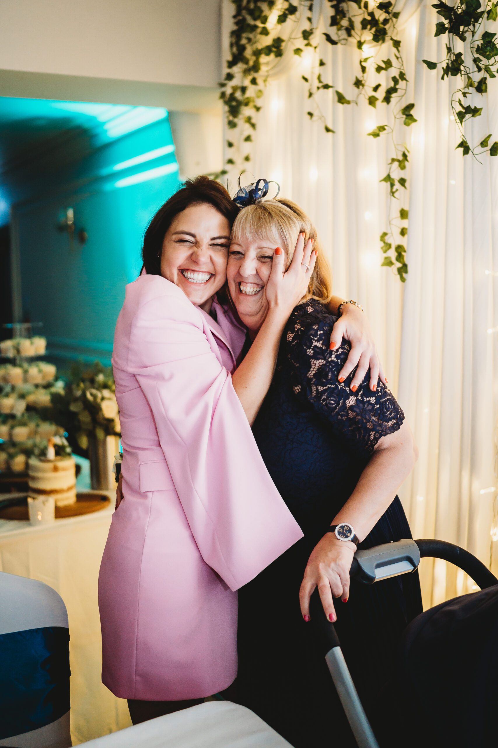 a wedding guest hugging on to another guest during ahmpshire wedding  
