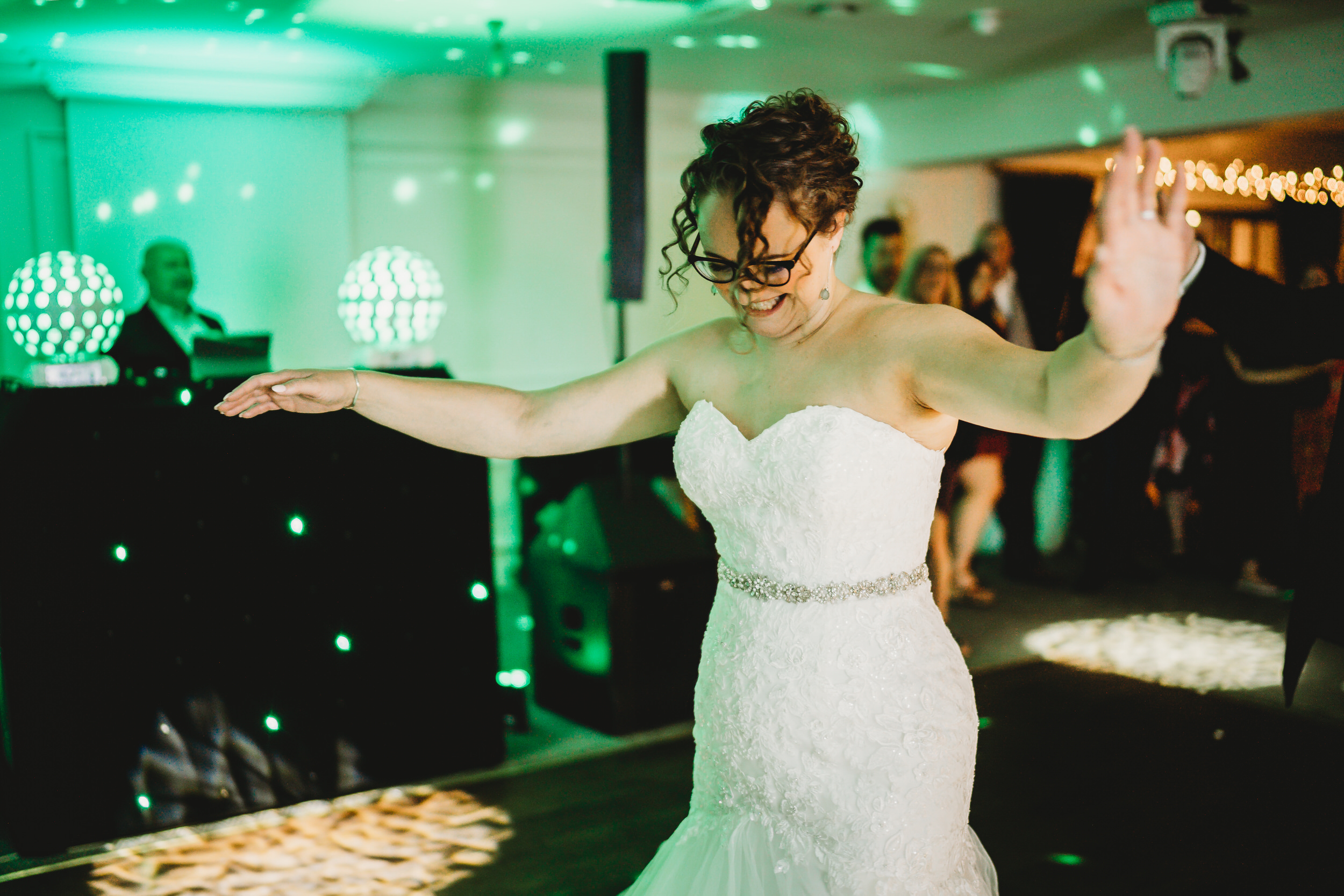 a bride dancing on her wedding day for a hampshire wedding photographer 