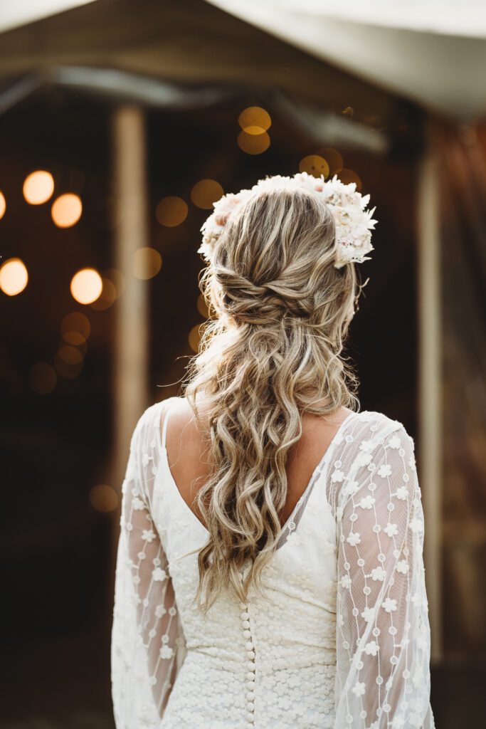 a detail image of a brides boho themed festival wedding hair