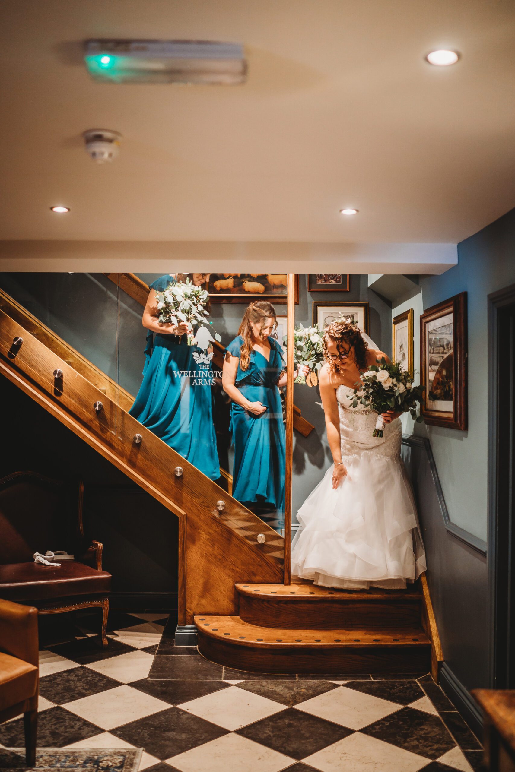 a bride and her bridesmaids walking towards her ceremony