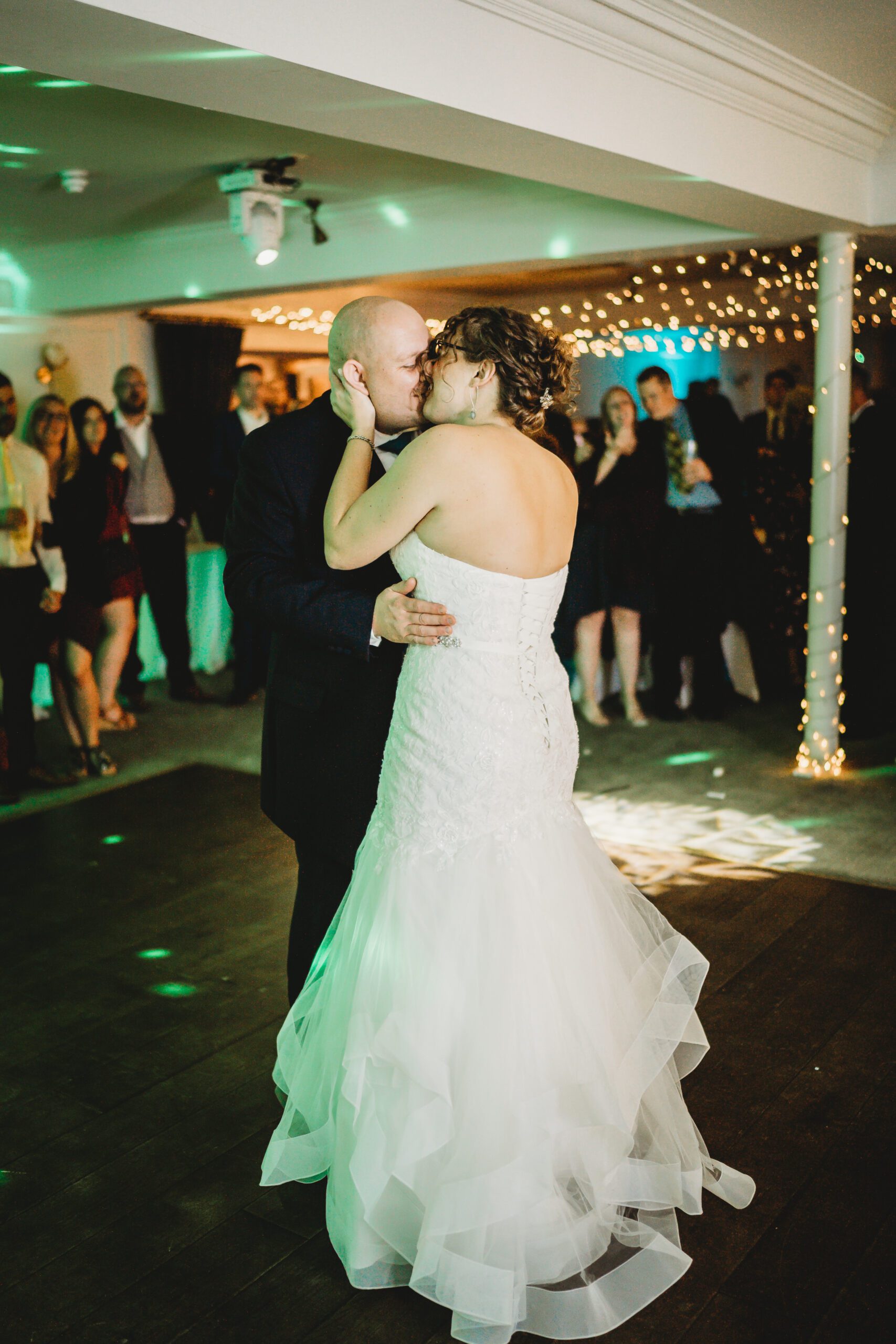 a bride and groom enjoying theit first dance after their wedding 
