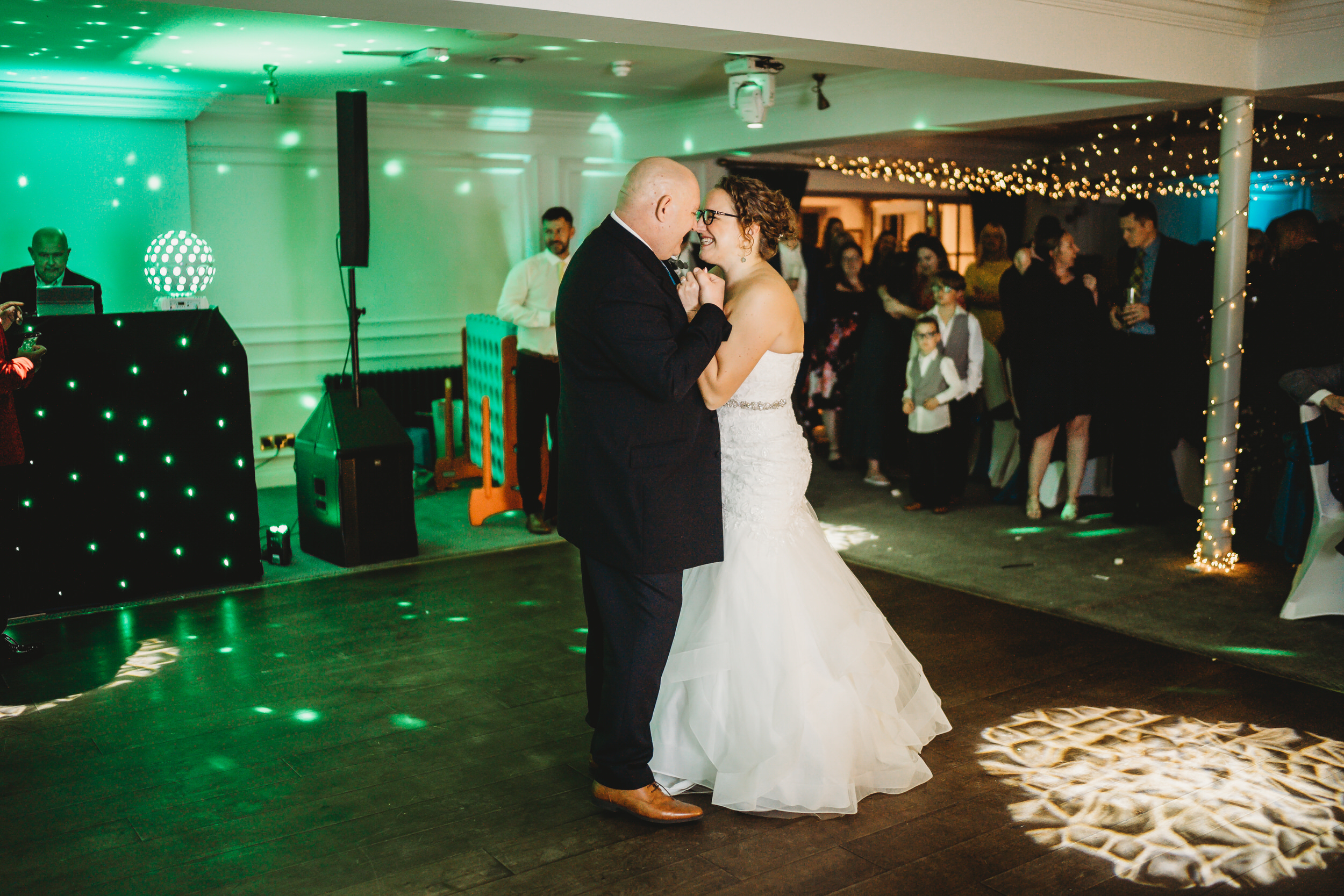 a bride and groom enjoying theit first dance after their wedding