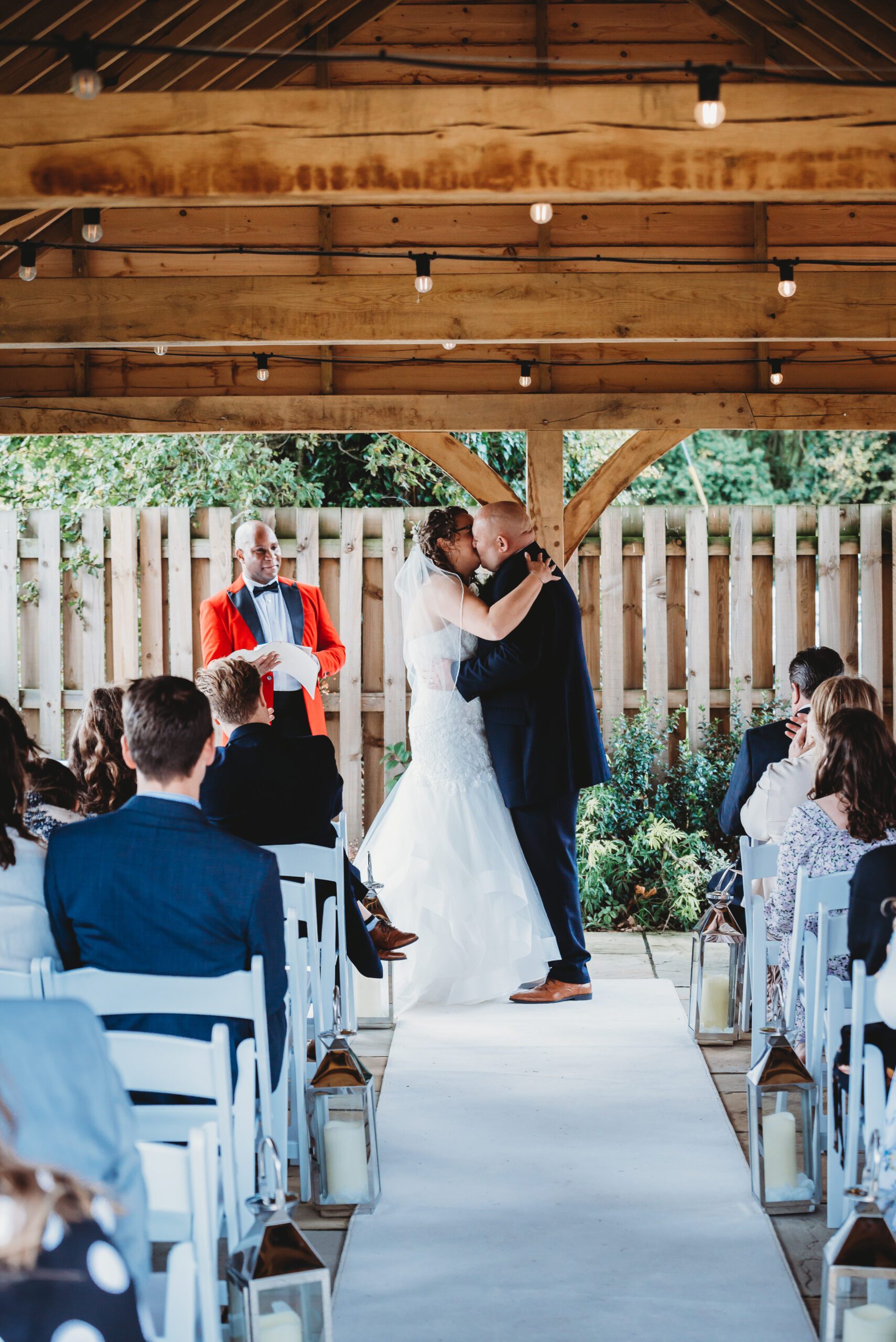 a bride and grooms first kiss after getting married during a hampshire wedding
