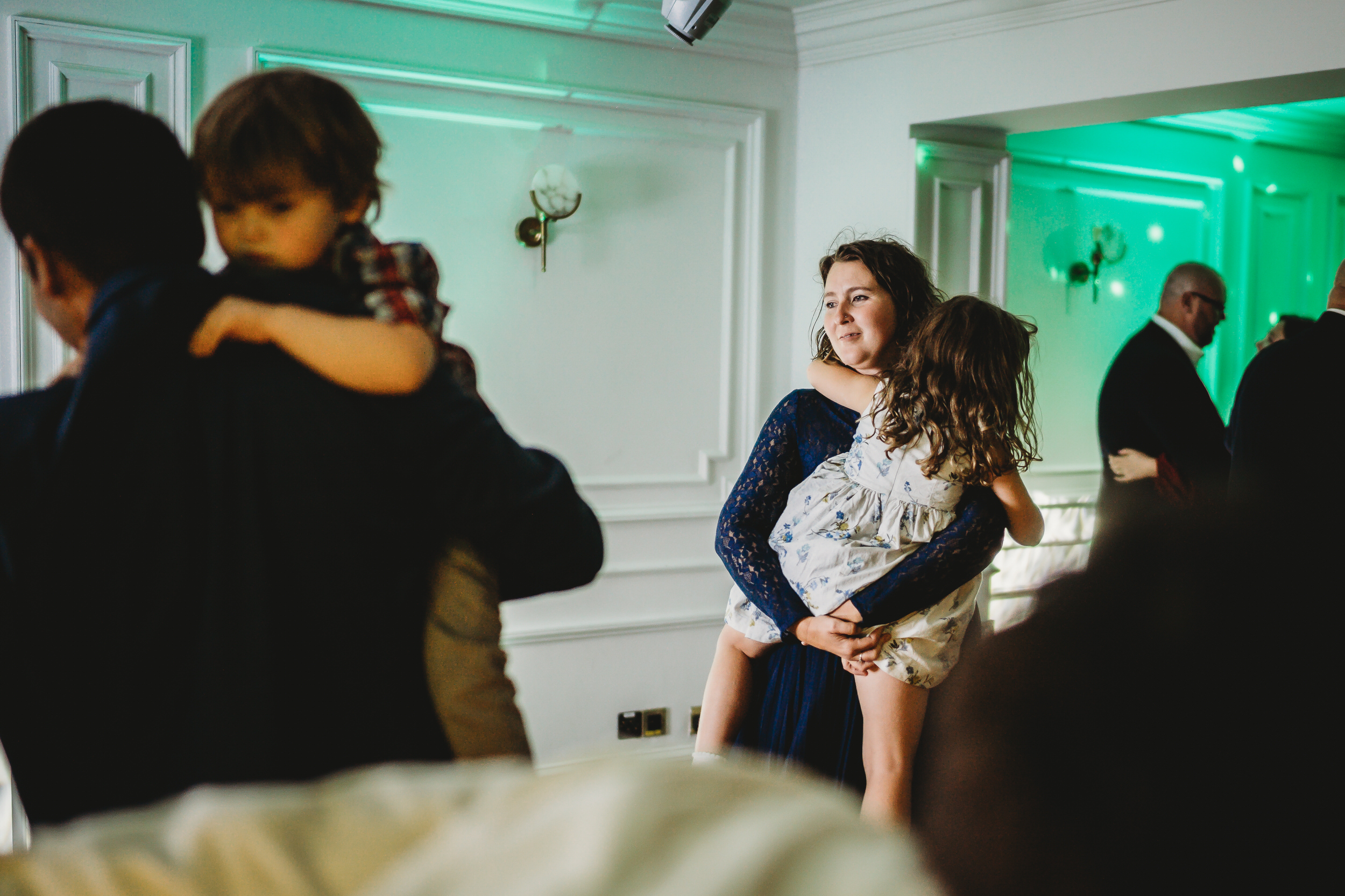 a mum and daughter dance together during a wedding reception at the wellington arms 
