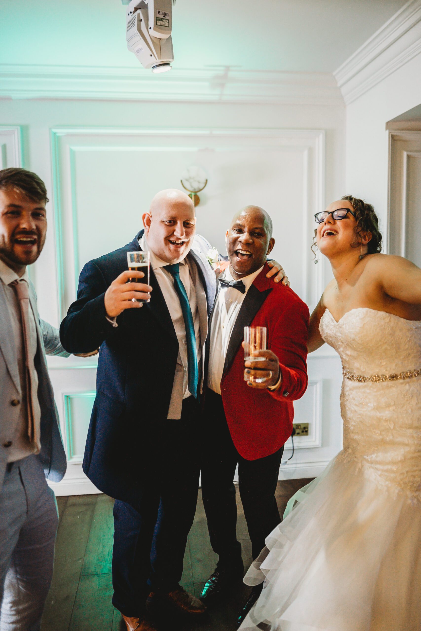 a bride, groom and their celebrant posing for their hampshire wedding photographer 