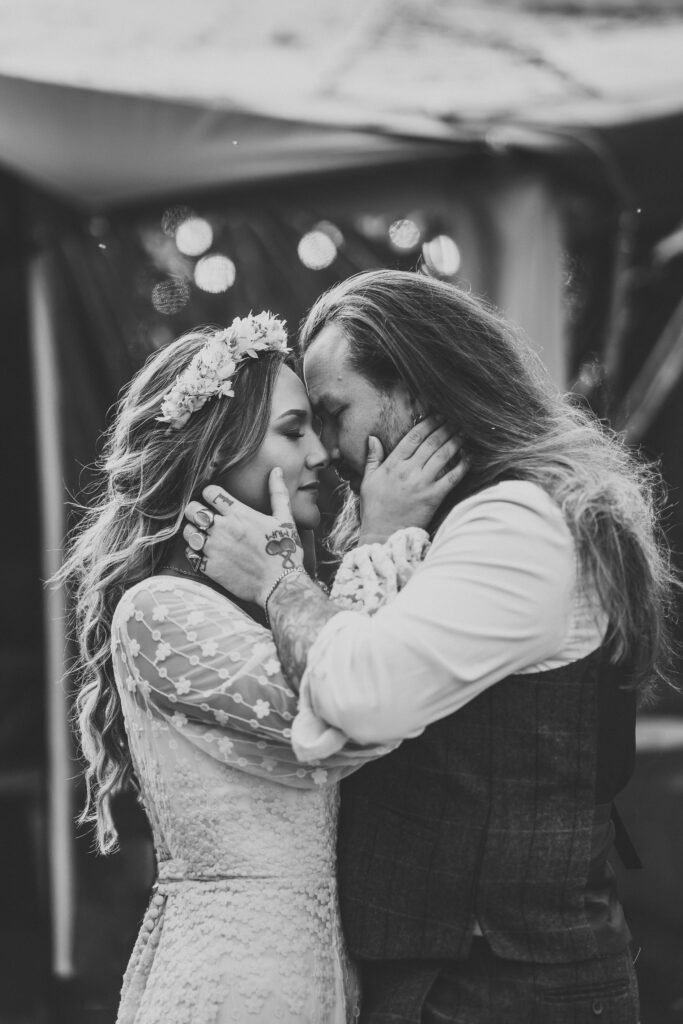 festival wedding photography of a bride and groom holding each other 