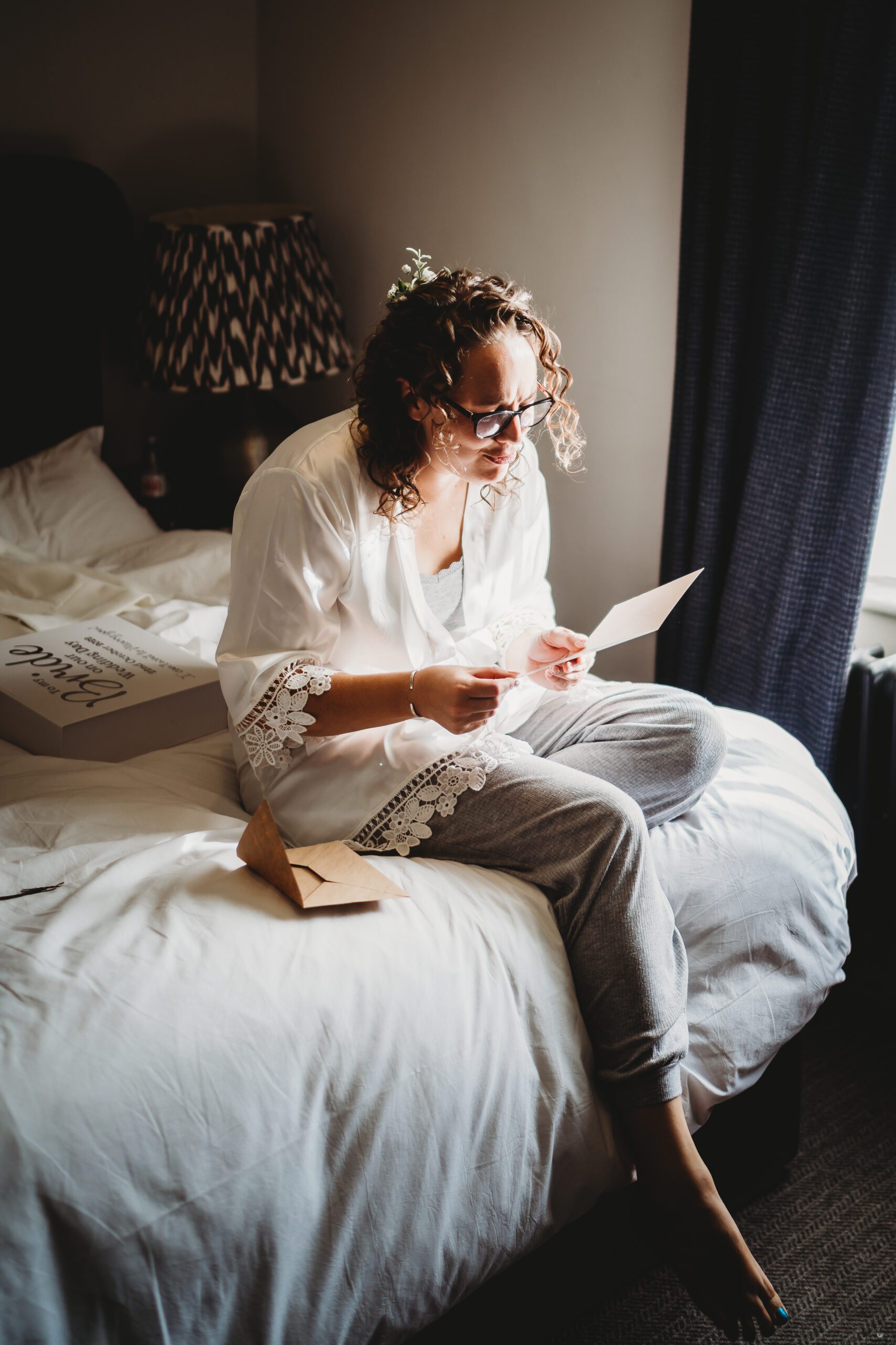 a bride reading a card from her husband to be for their hampshire wedding