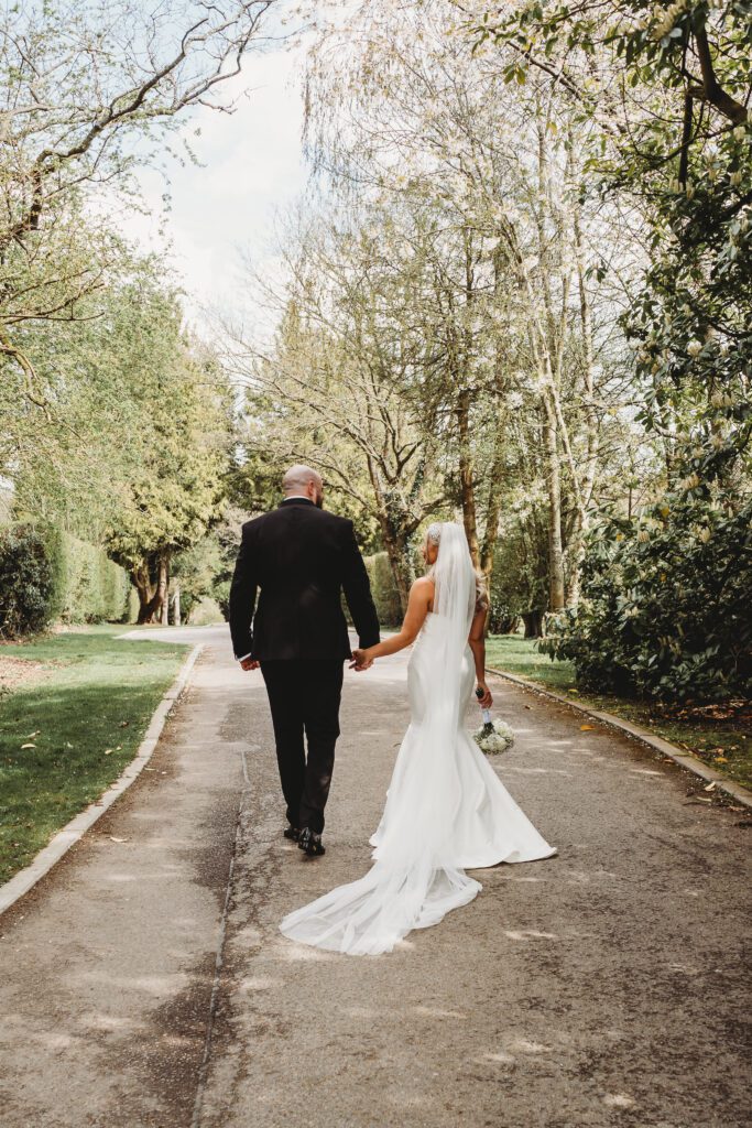 a bride and groom walking away after the ceremony