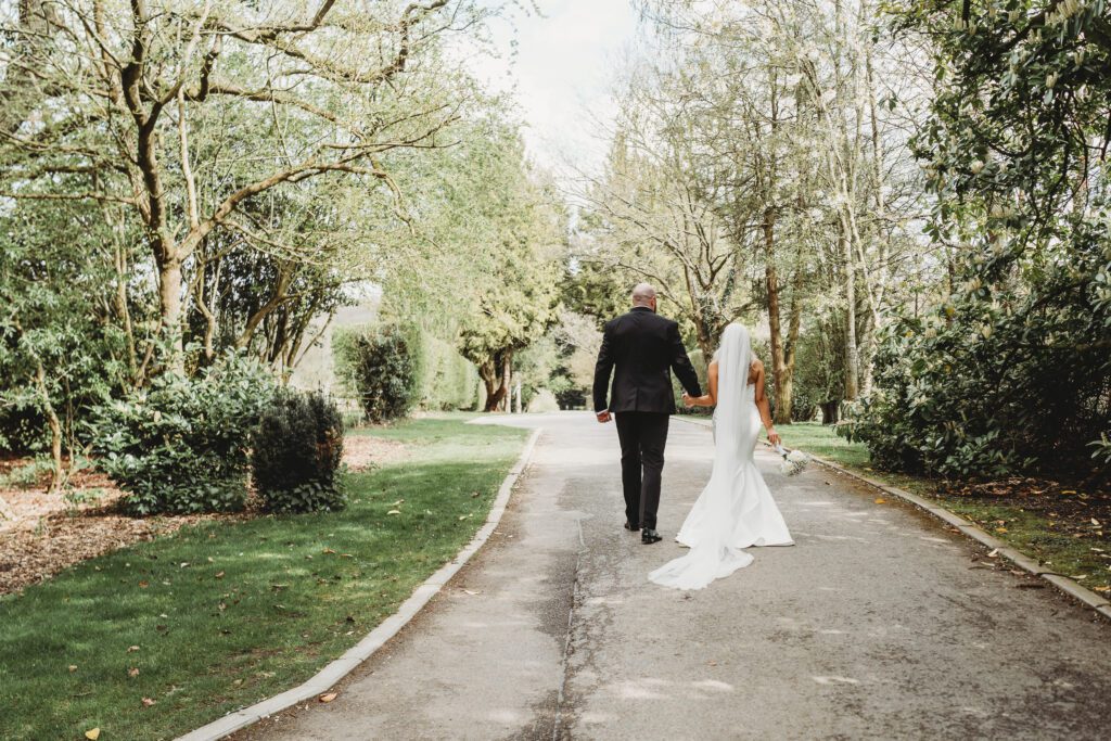 a bride and groom walking away after the ceremony