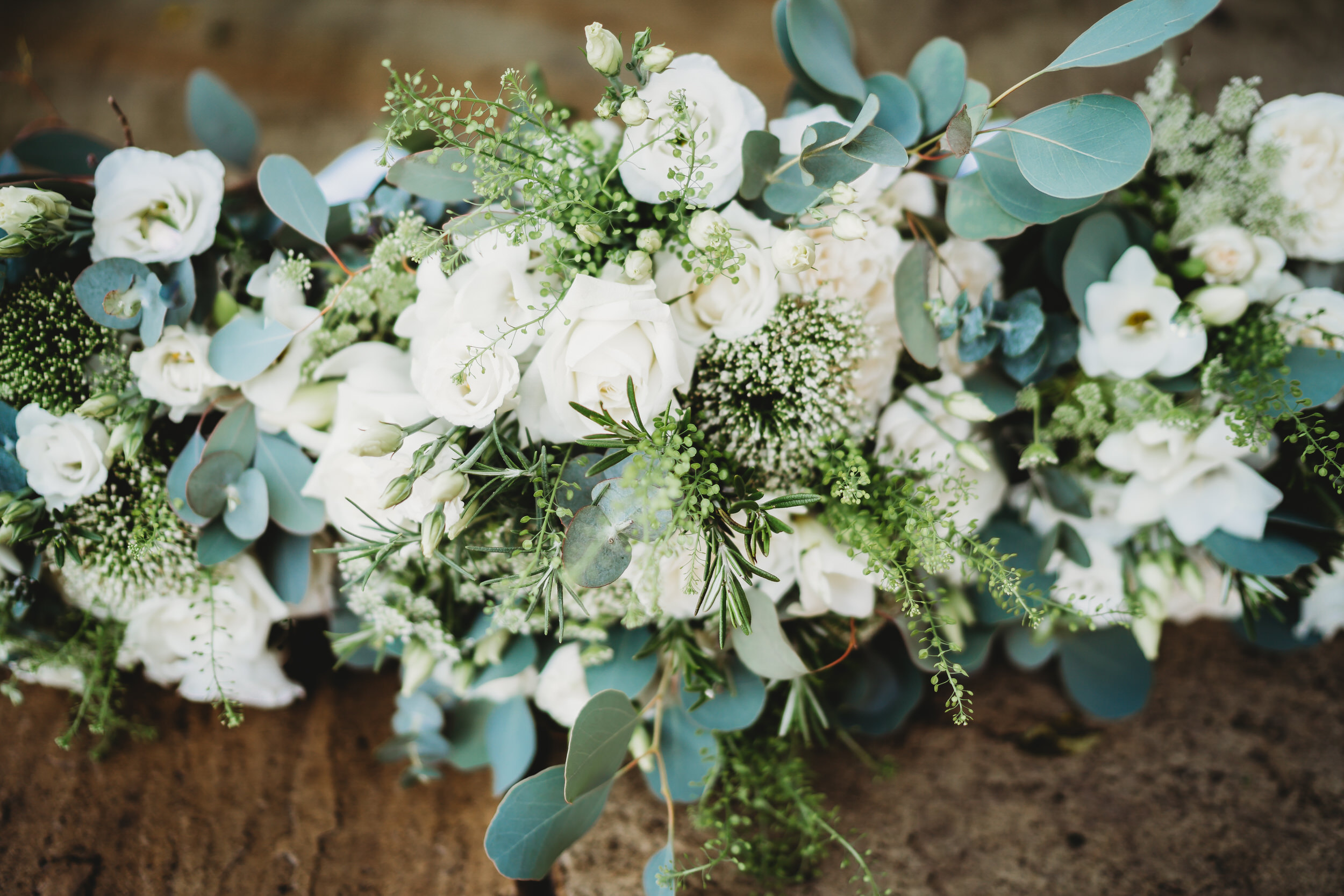 a brides white and green floral bouquet 