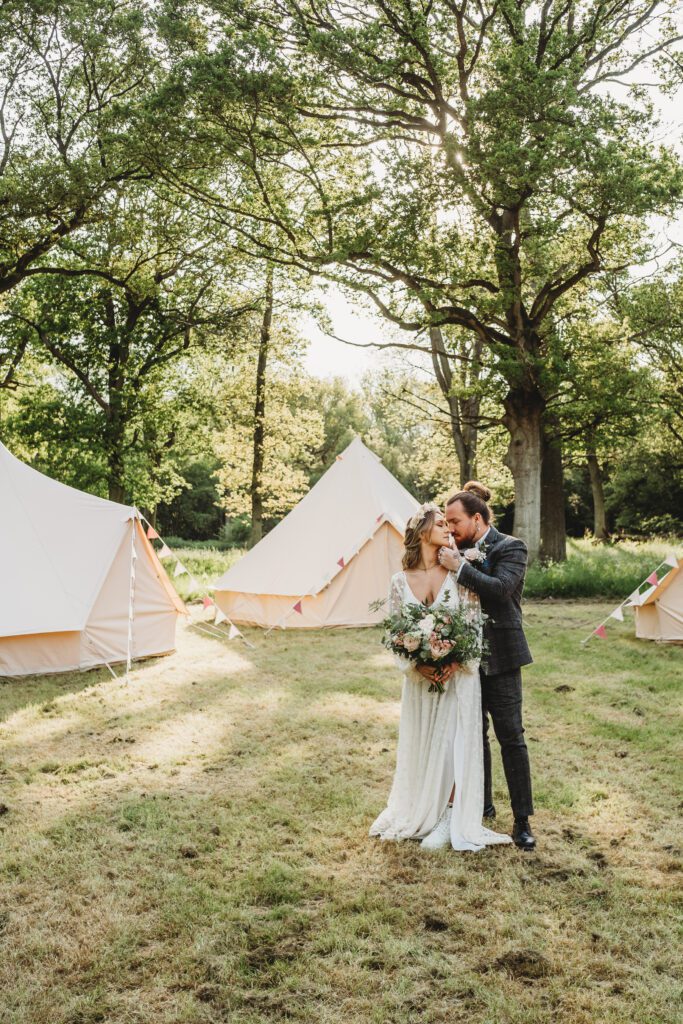 a bride and groom cuddling together following their festival wedding ceremony