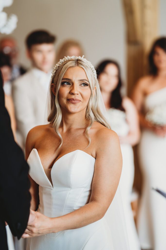 the bride looking at the registrar during her ceremony 