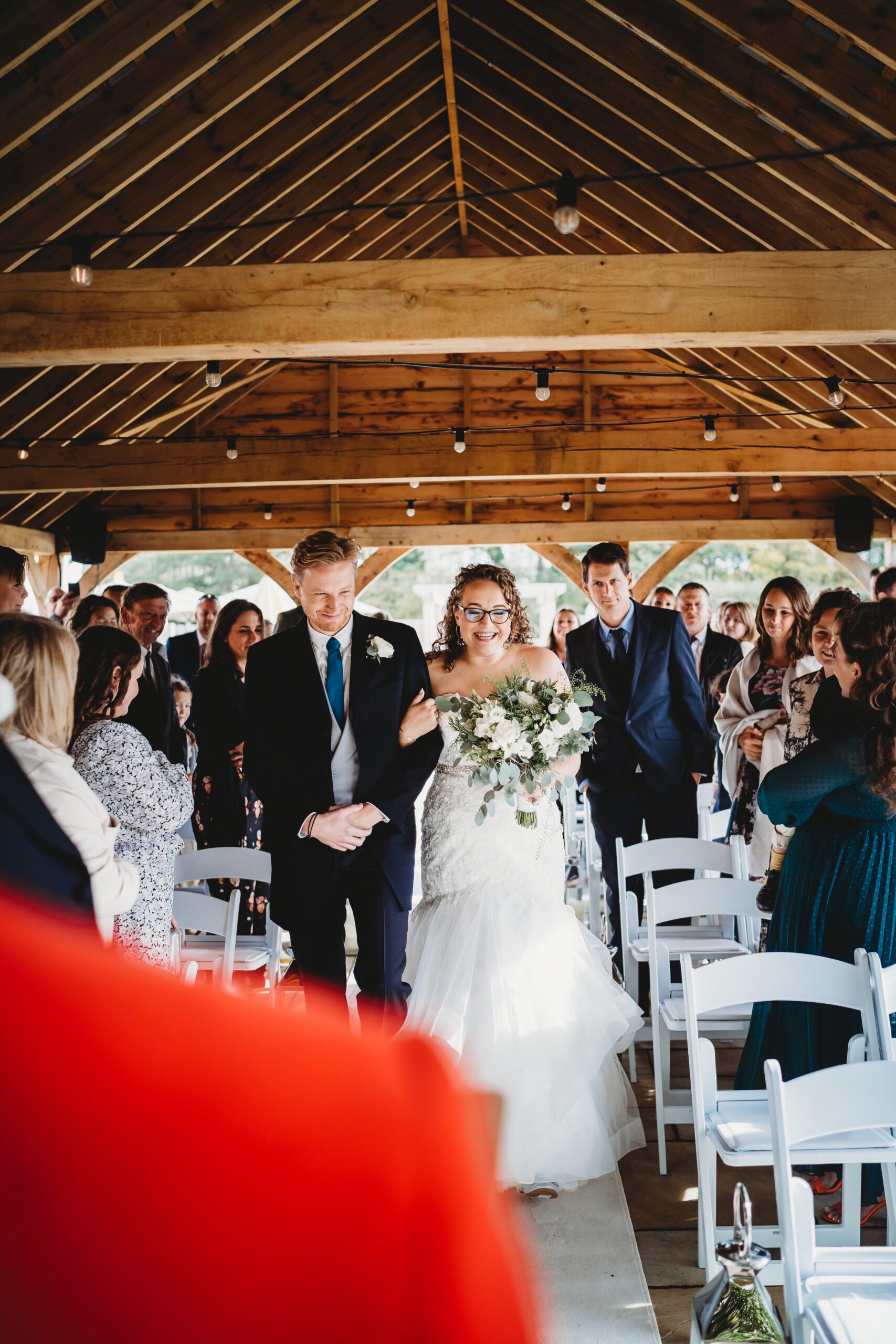 a bride and her brother arriving at the front ready to get married