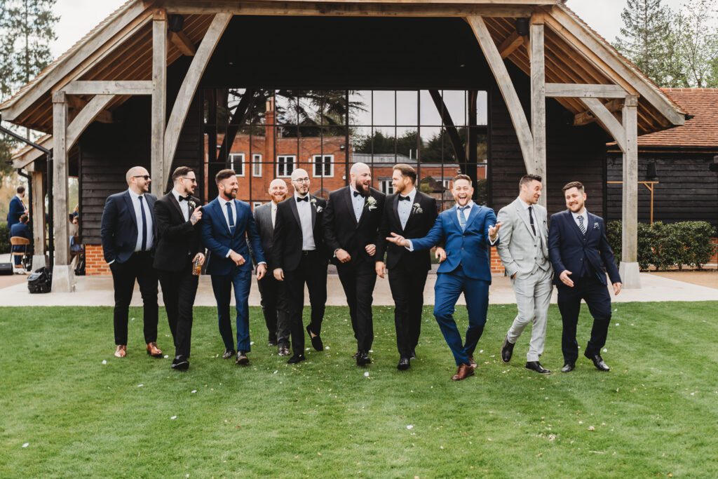 grooms men walking towards the camera for a newbury wedding photographer 