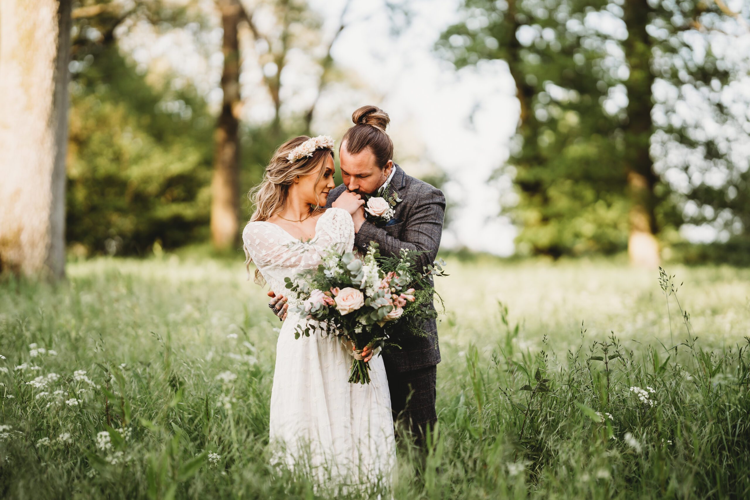 a newly married couple cuddling for a Berkshire Wedding Photographer